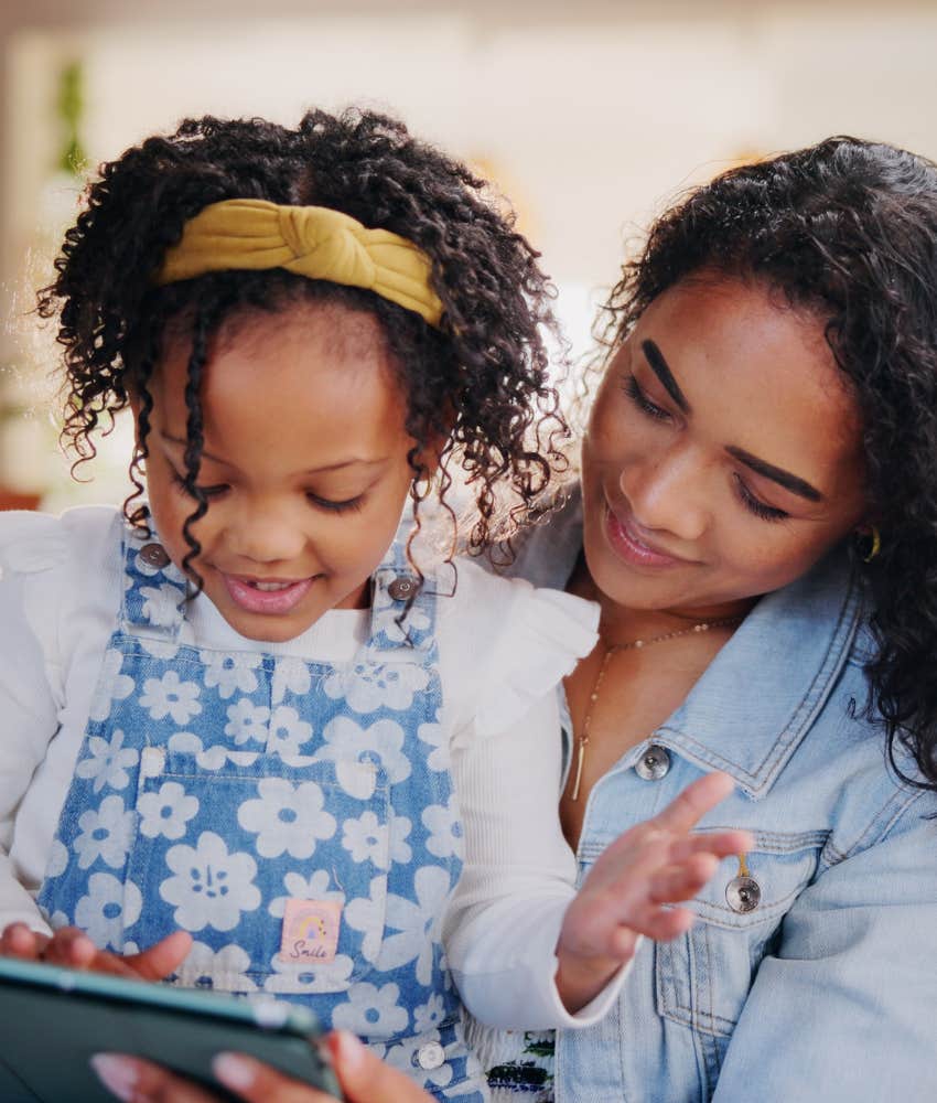 Patient mother teaching amazed daughter