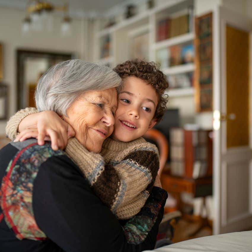 grandmother hugging grandson