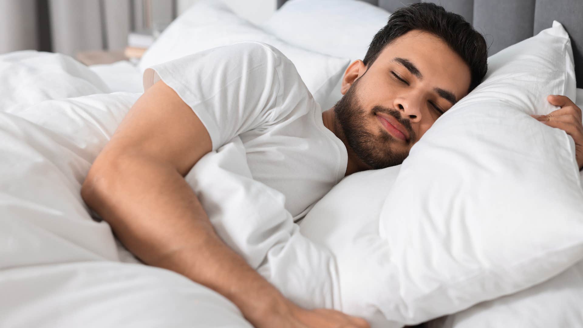 Man who's guarded with emotional walls sleeping at home.