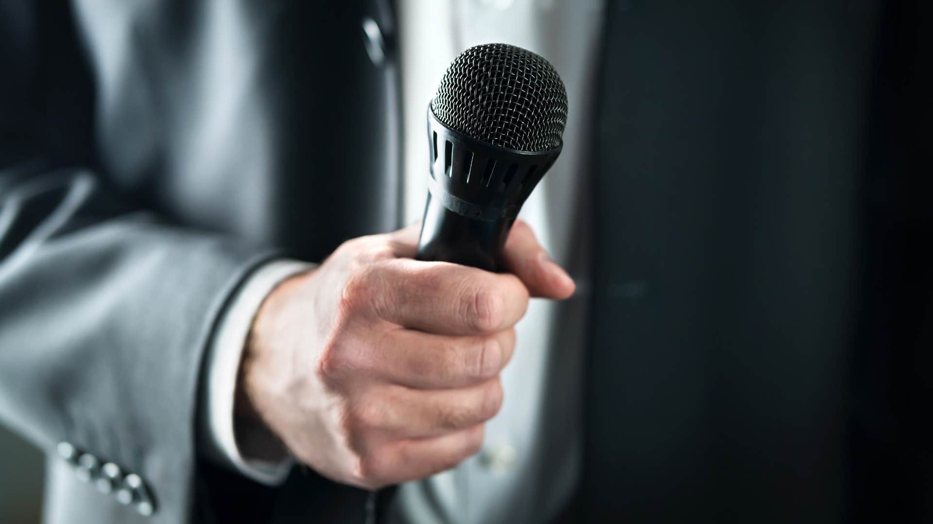 hand in microphone ready to talk showing things boomers do