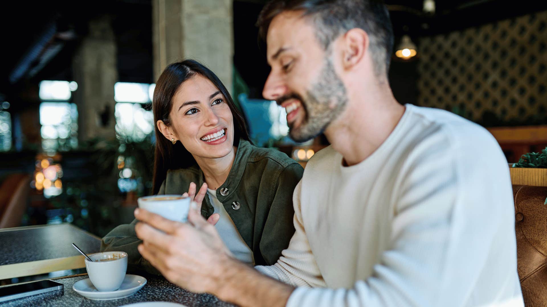 man who is emotionally secure giving compliments to woman