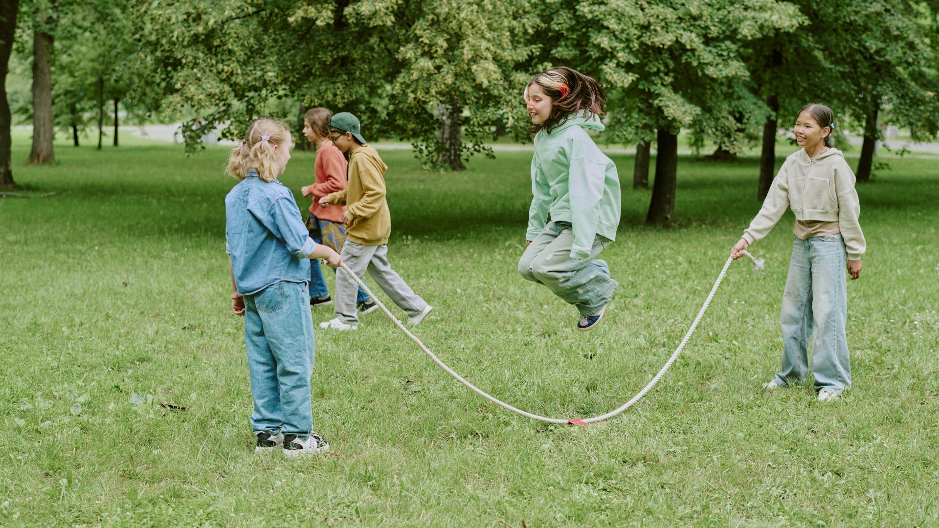 group of girls jumping rope in the park