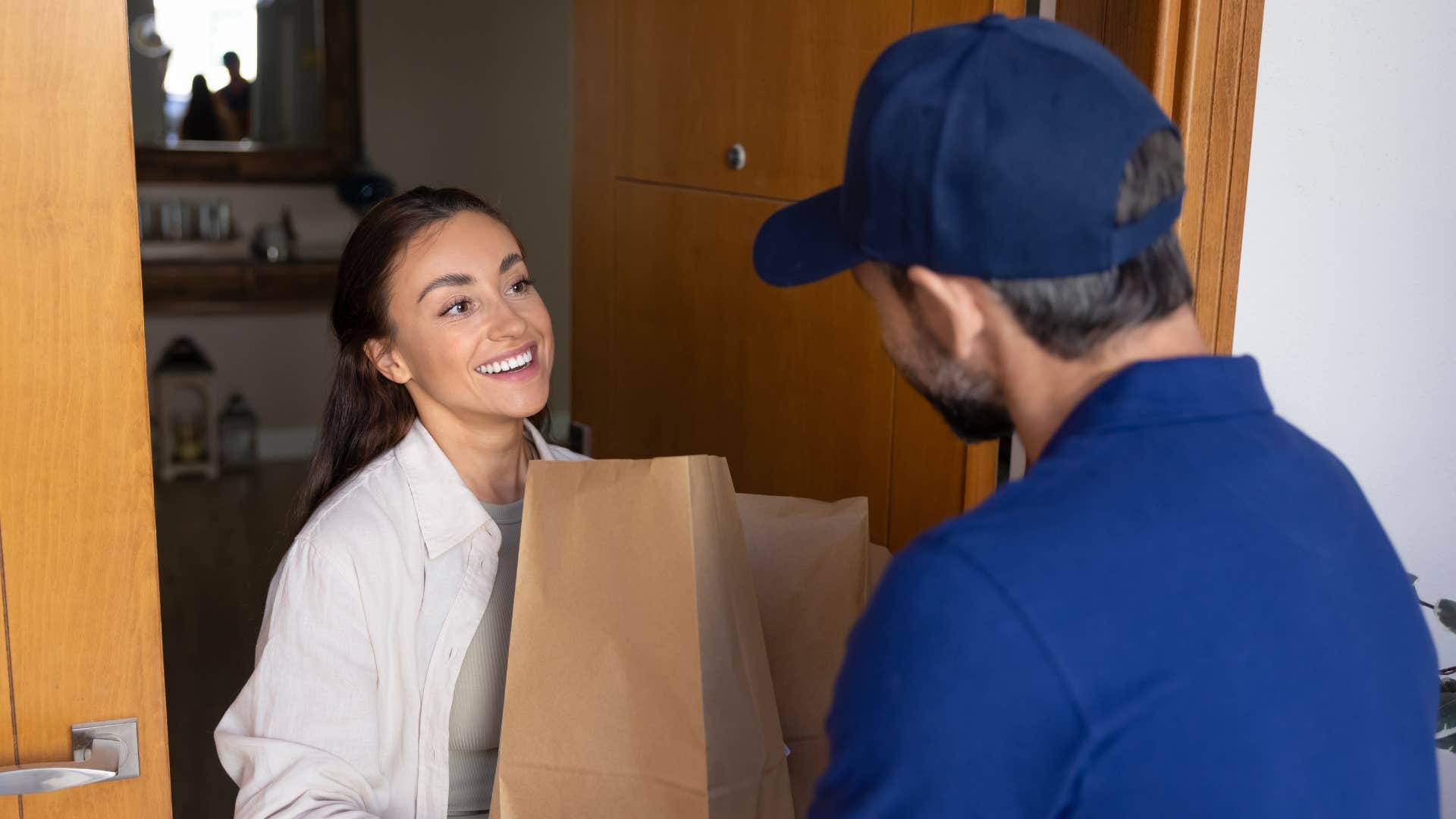 woman receiving delivery of essentials she needs