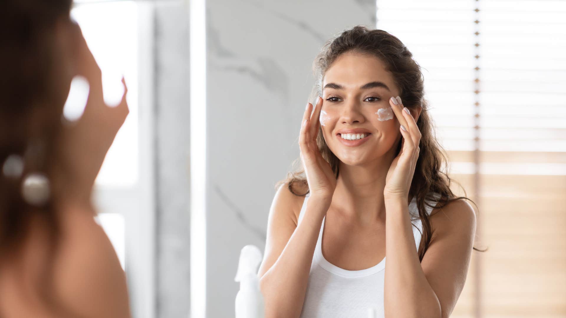 woman downgrading her skincare routine to essentials