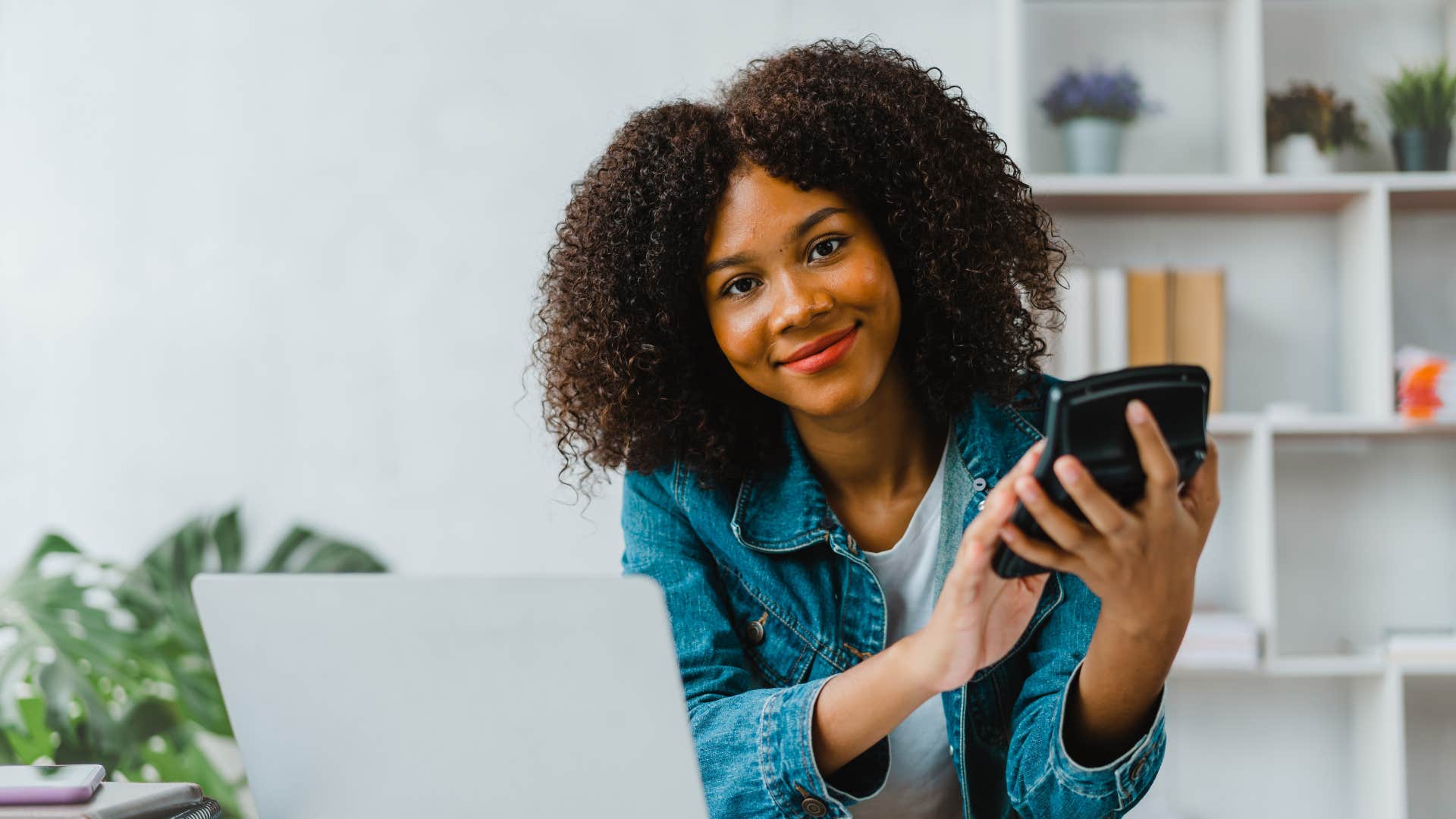 woman setting up automatic payments for her bills to overcome burnout