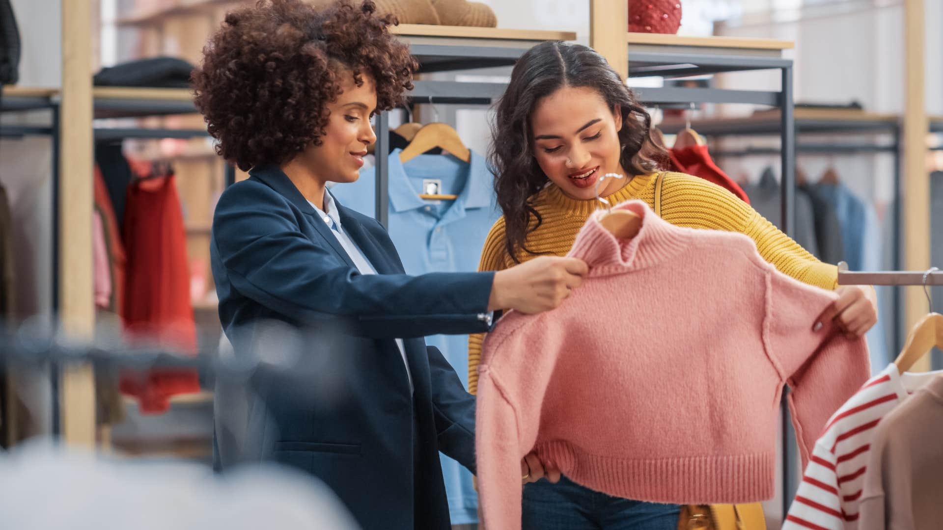 women thrifting for clothes instead of buying fast fashion