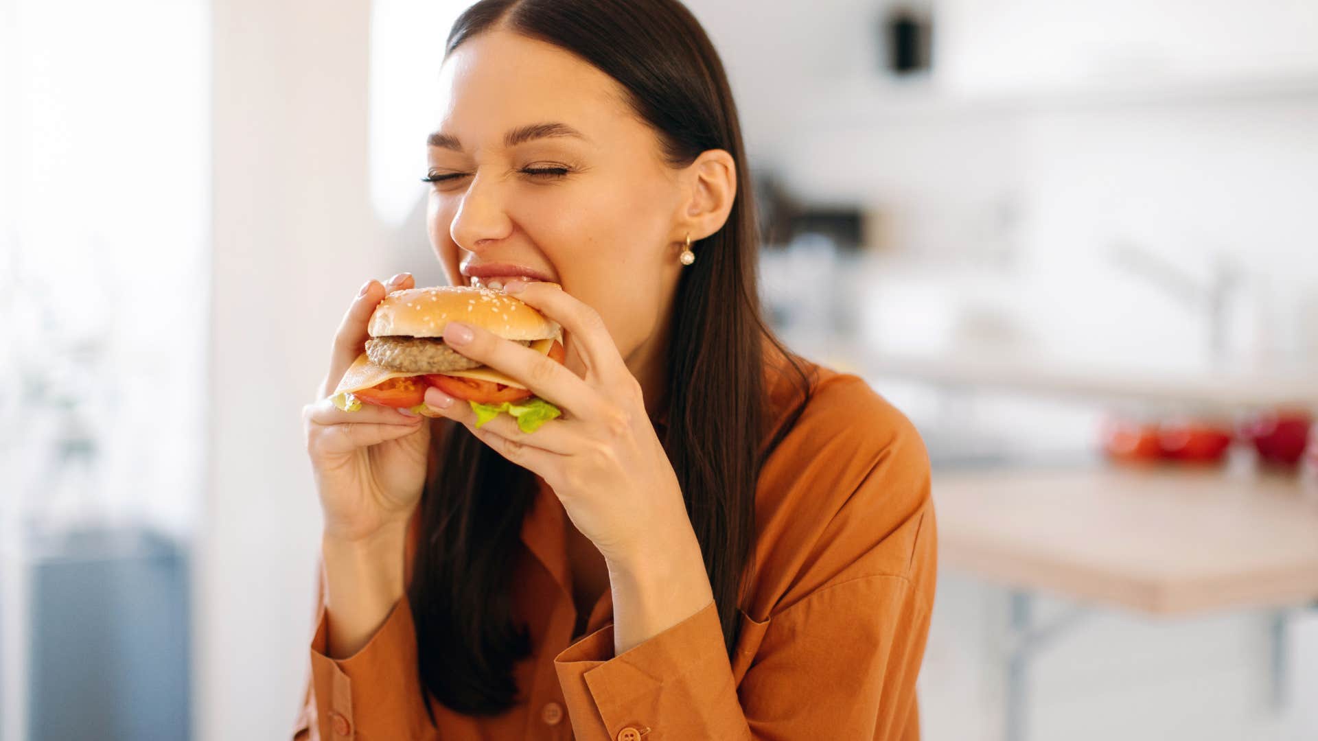 woman eating burger