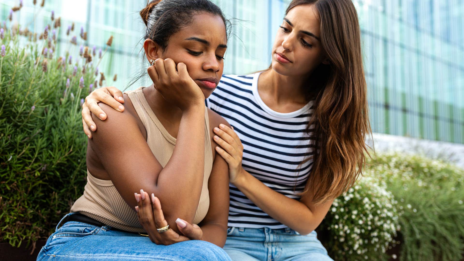 woman trying to comfort friend in bad mood