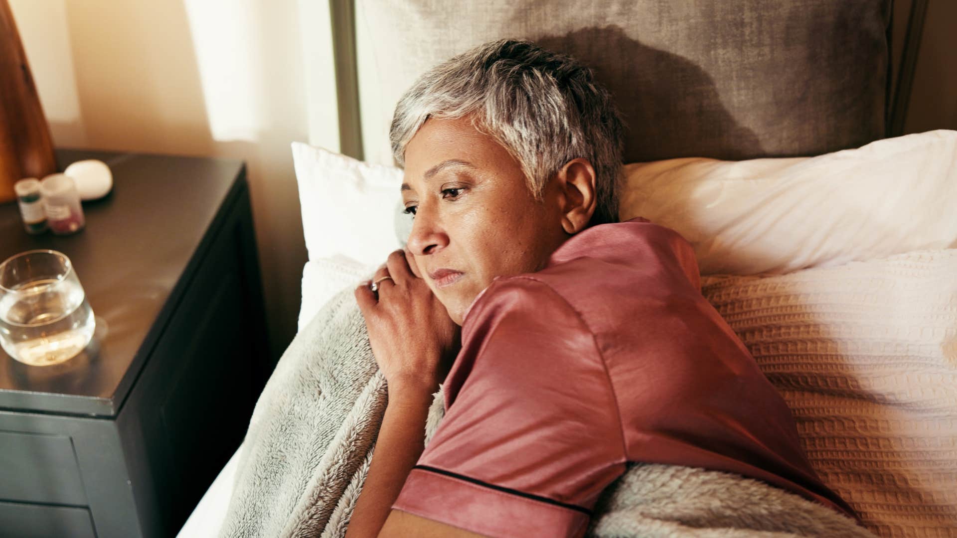 woman lying awake in bed