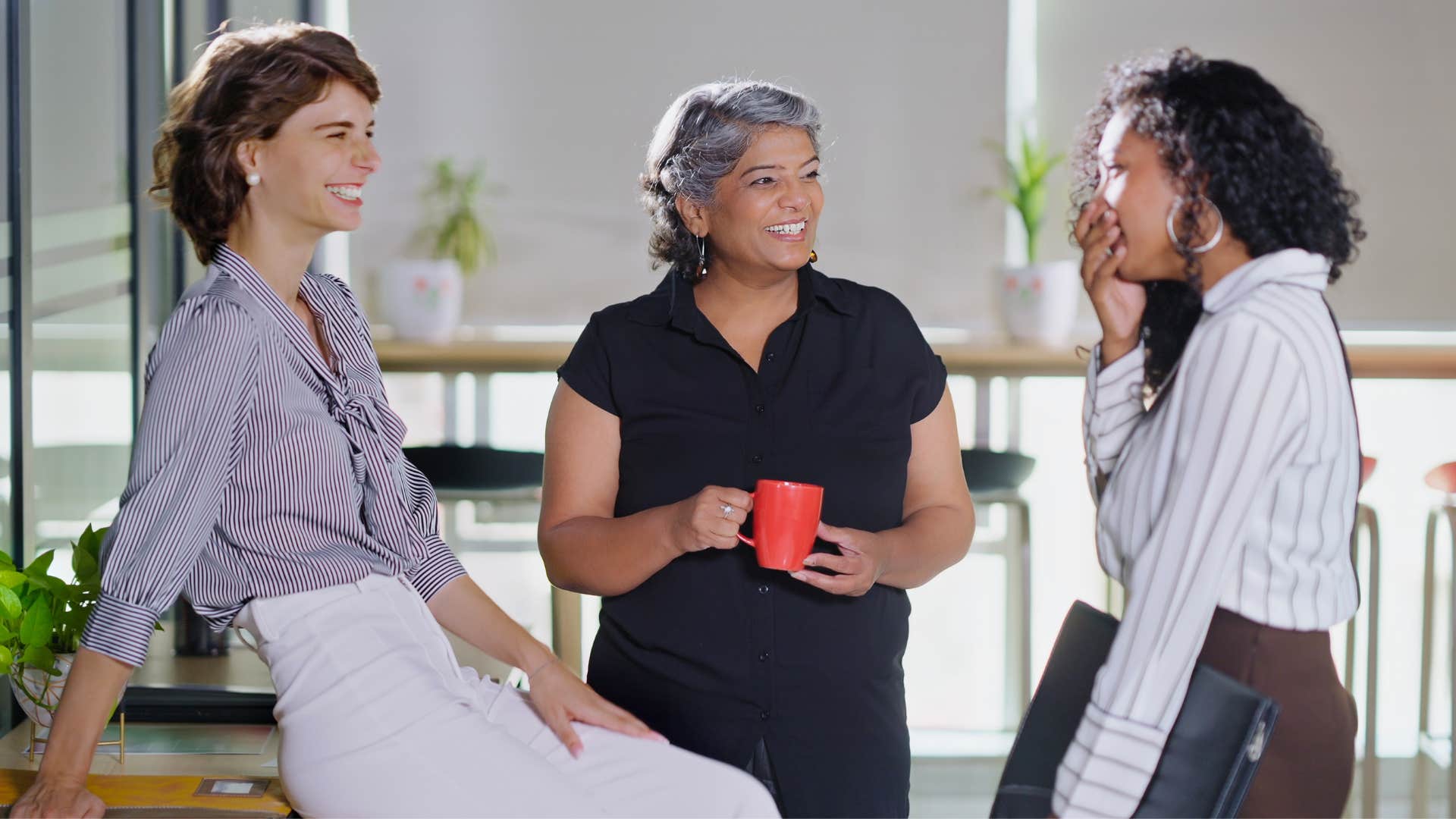 coworkers gossiping as they're subtle underminers