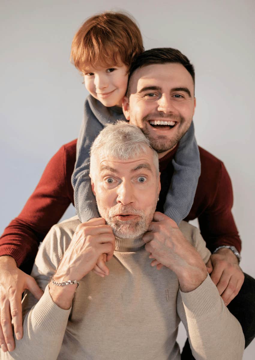 three generations of males being playful