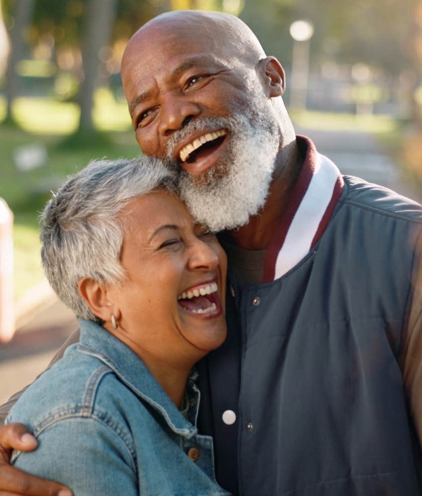 successful couple embrace