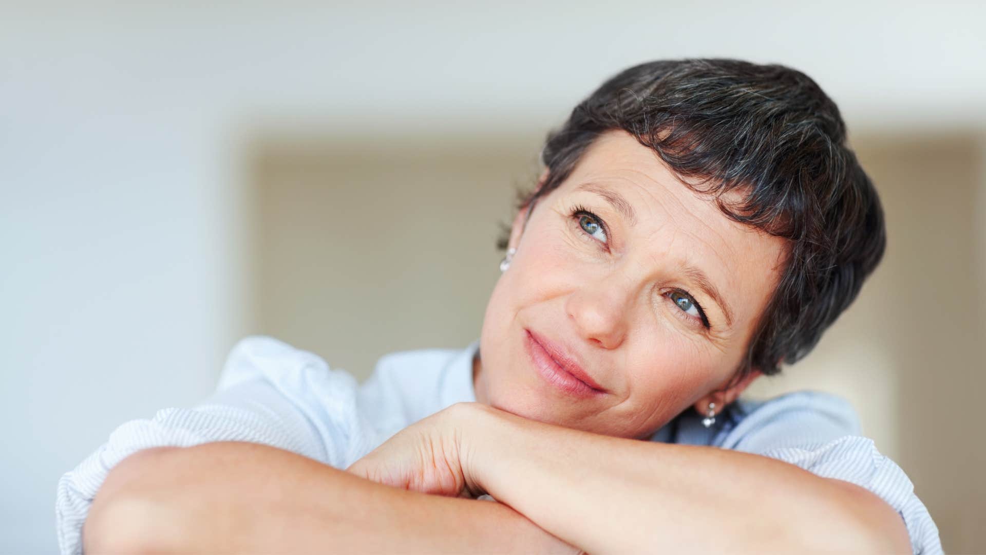 open-minded woman looking unbothered