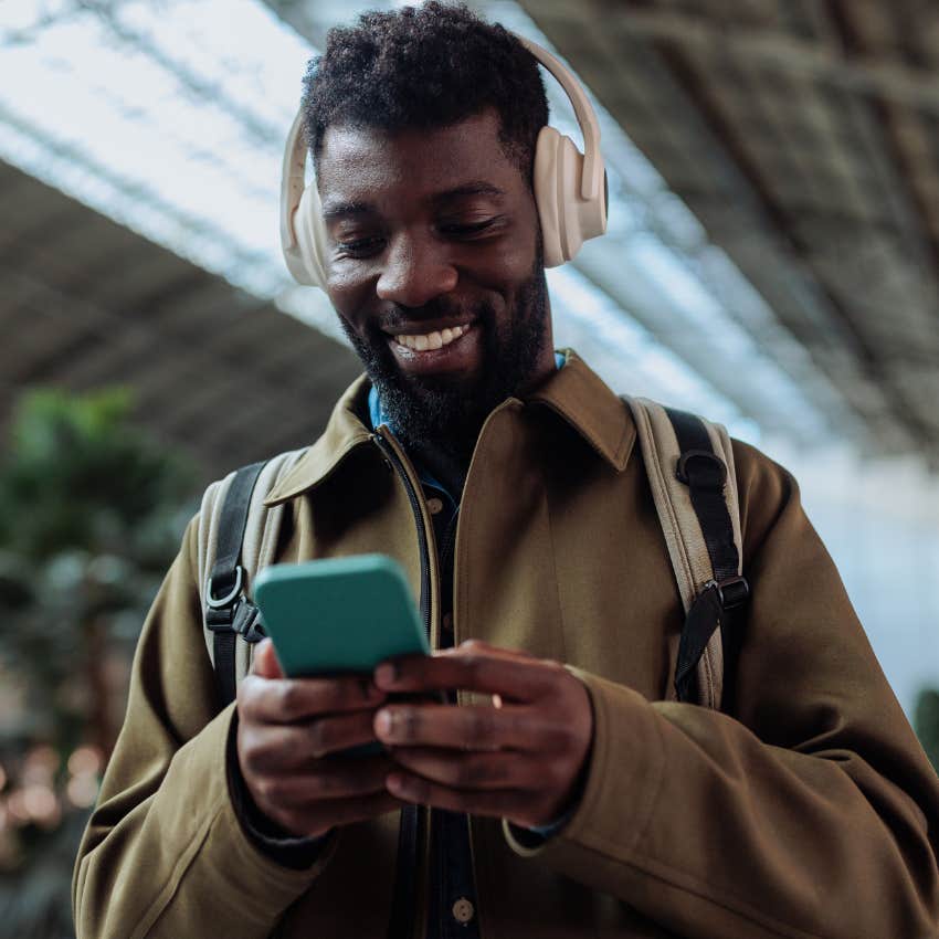 man sharing a song their partner would like on their phone