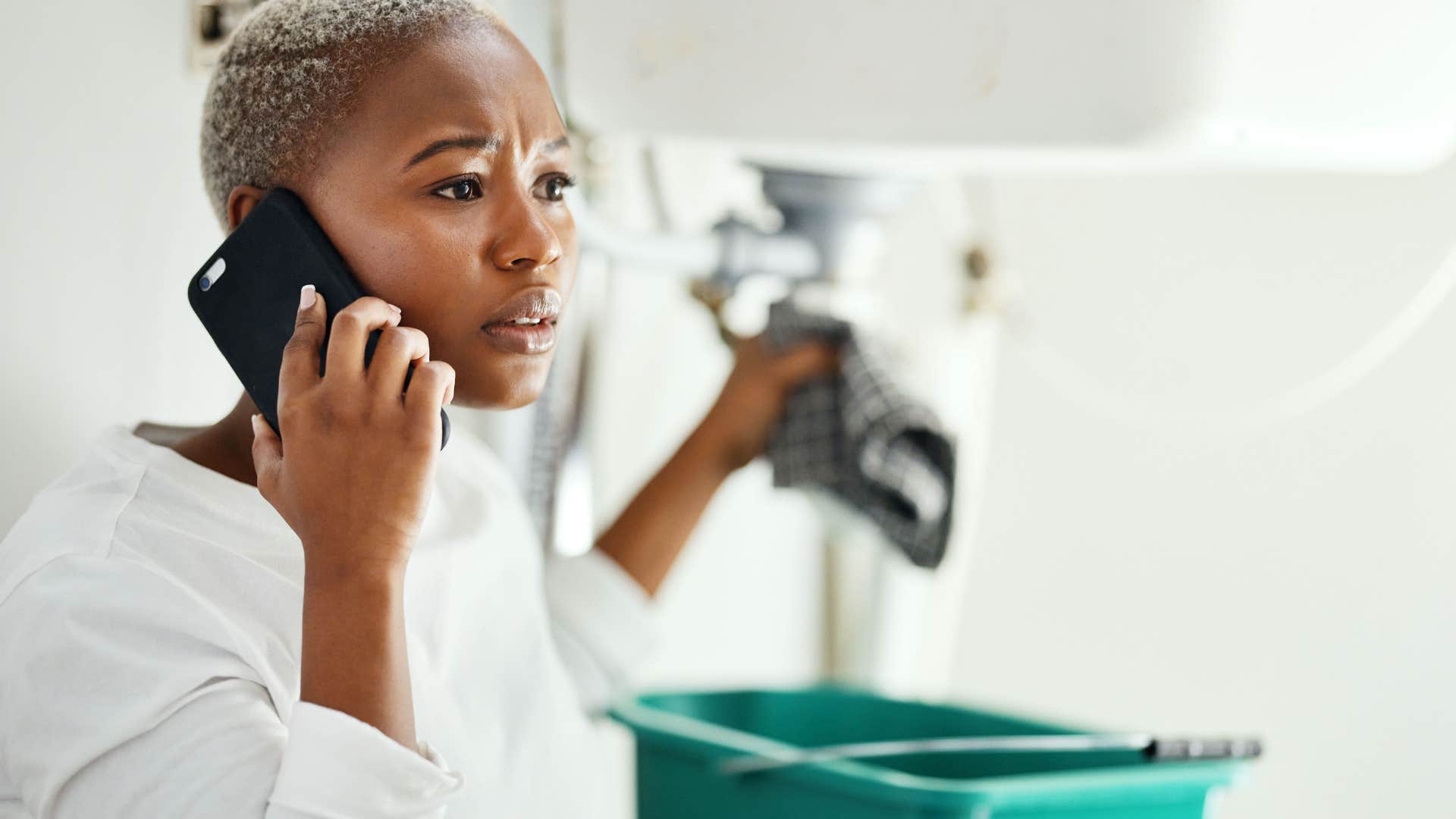 concerned person with plumbing problem calls family for help showing they have their life together
