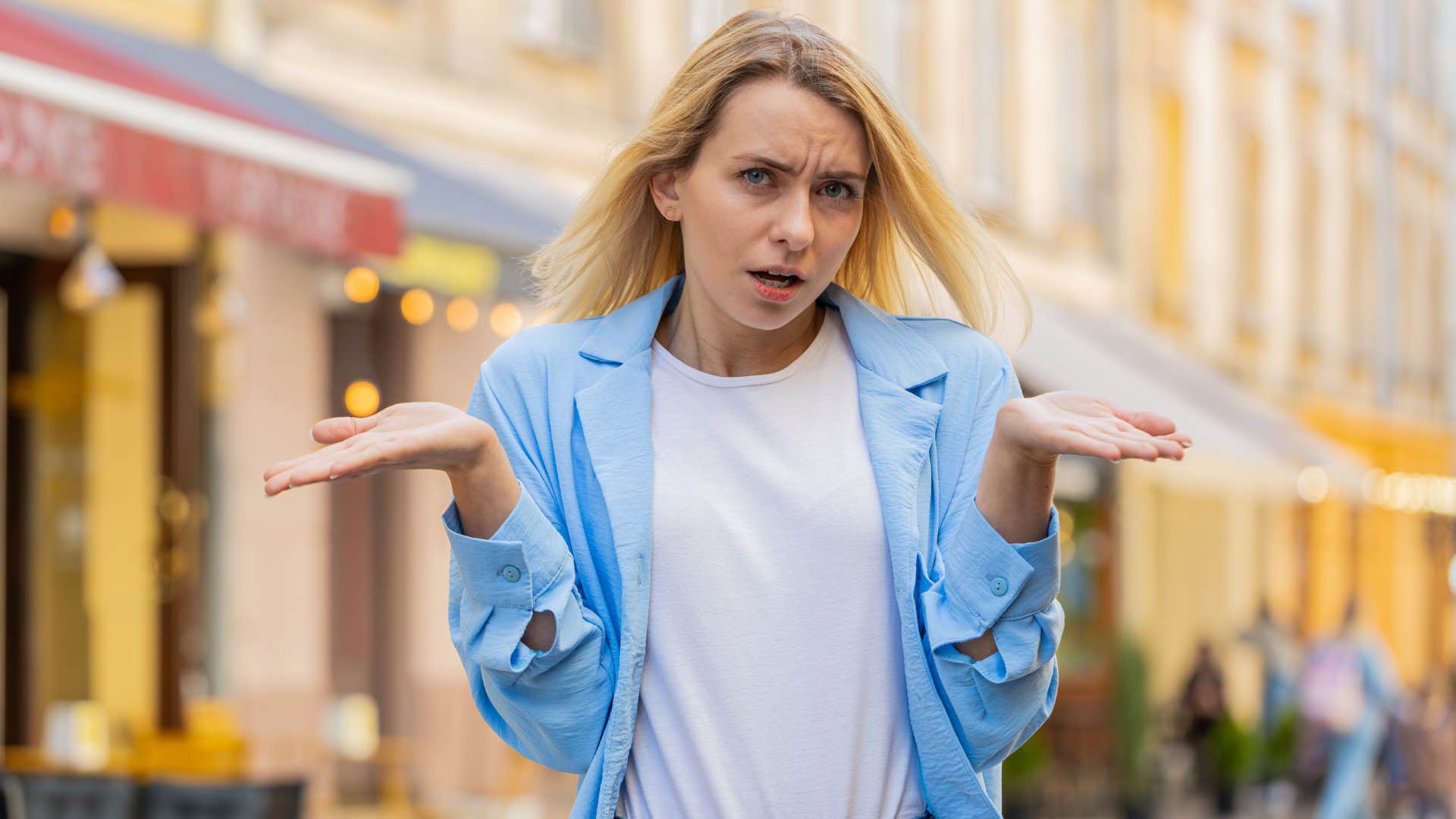 cofused person shrugs showing no one has their life together