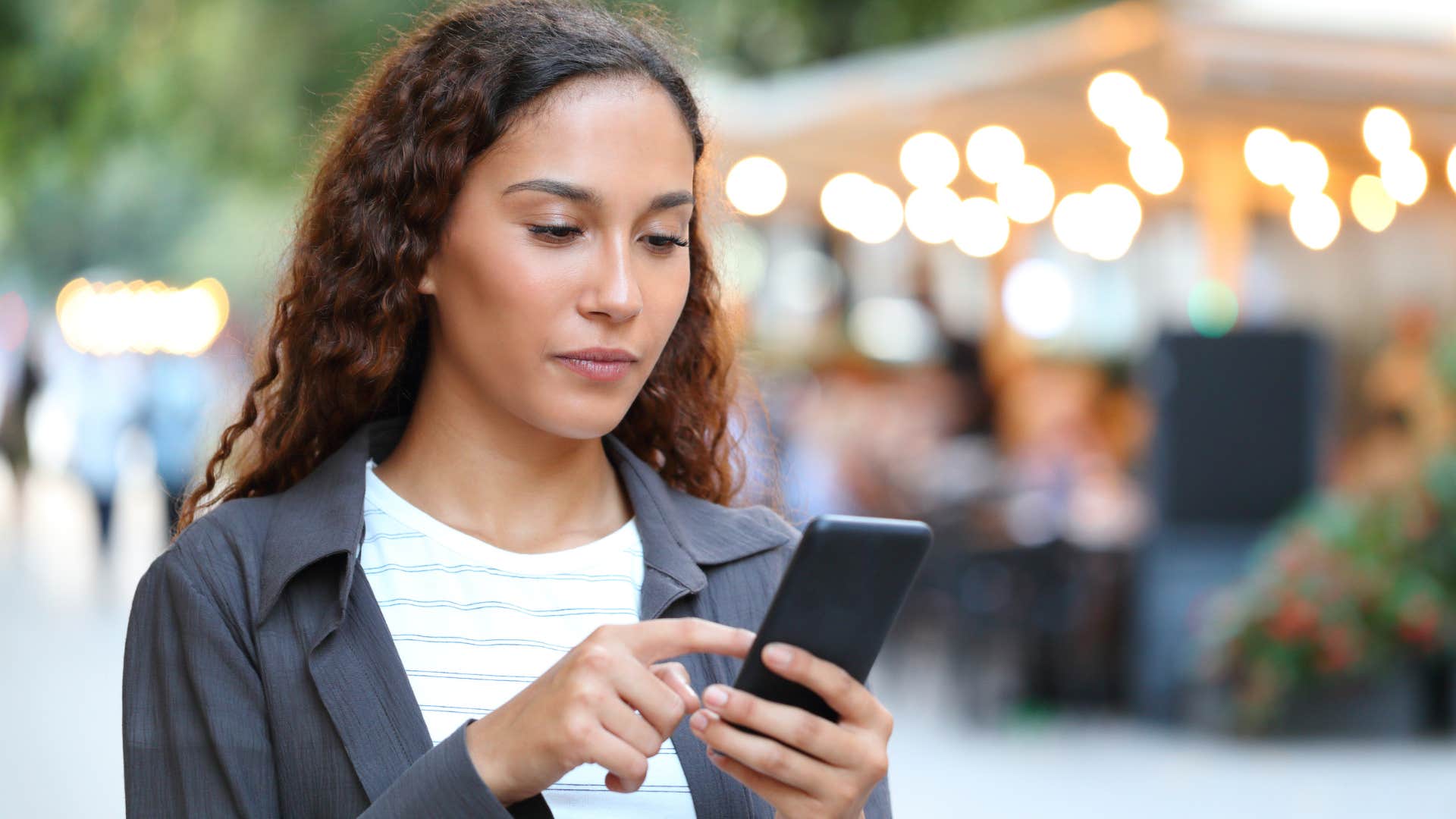 woman taking a break from social interactions standing outside