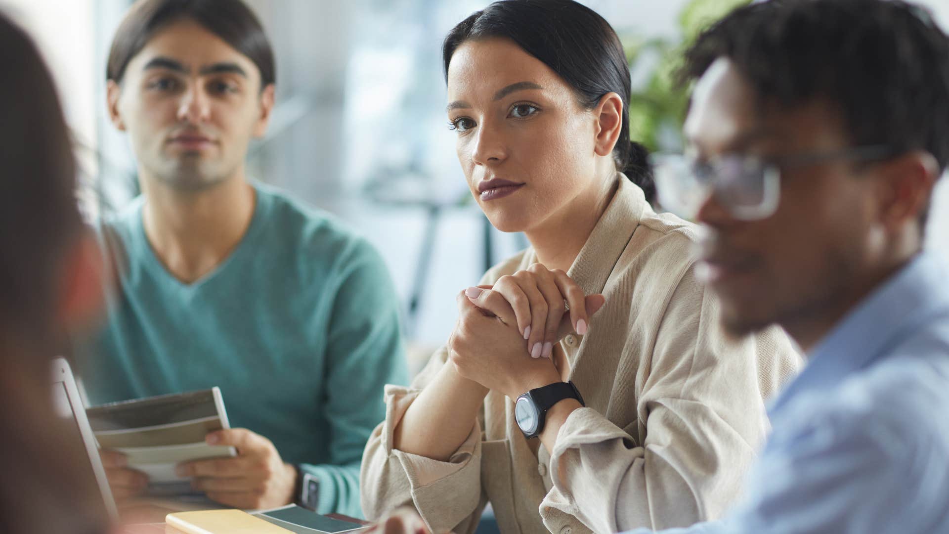 introverted woman observing conversations at work