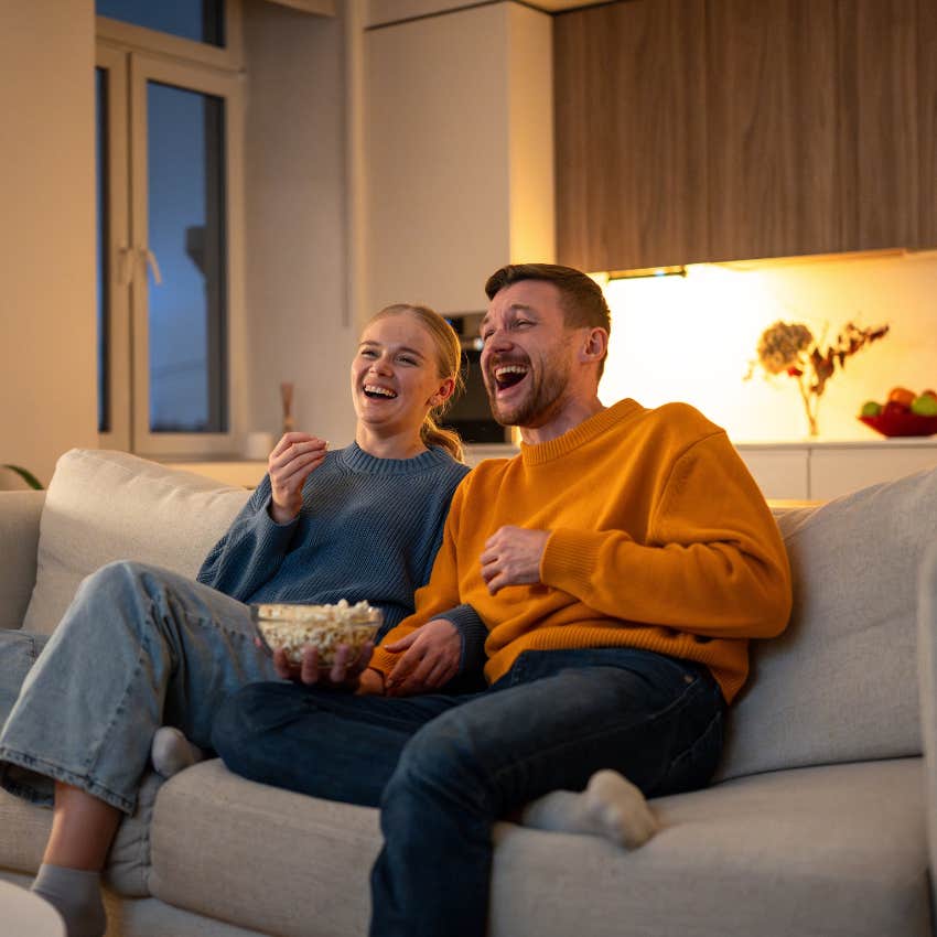 couple who communicates through memes watching memes together date night
