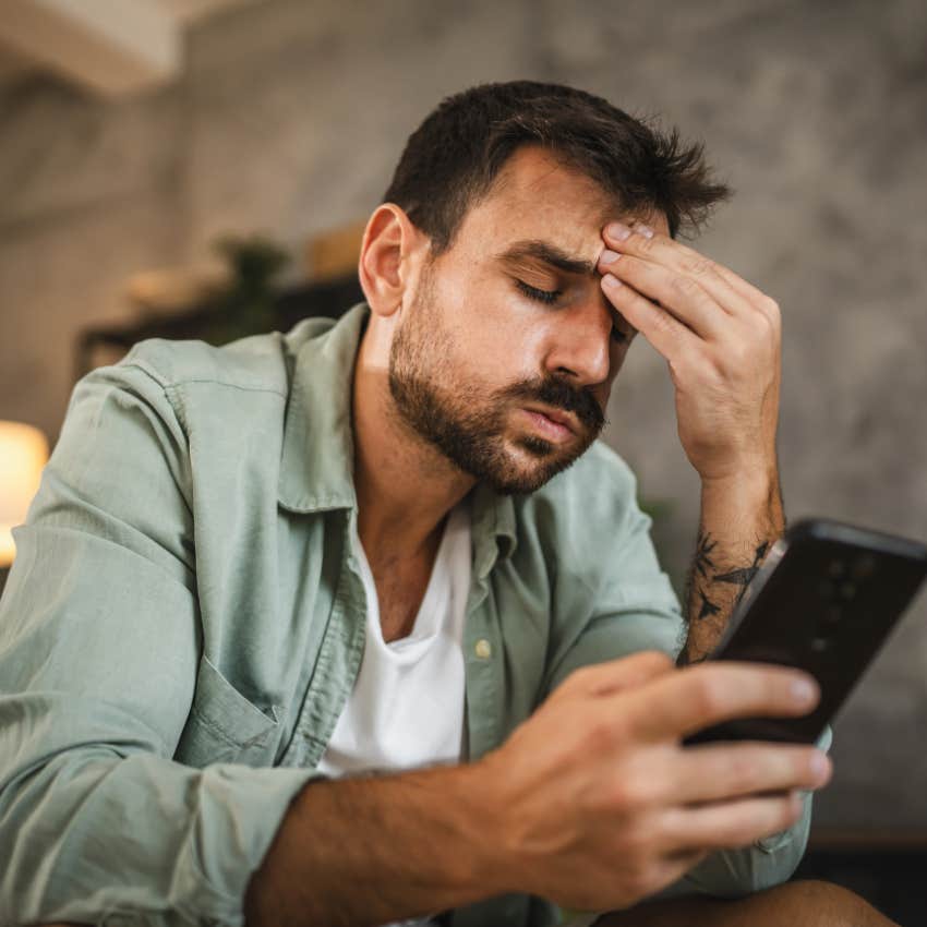 angry boyfriend looking at picture his girlfriend posted