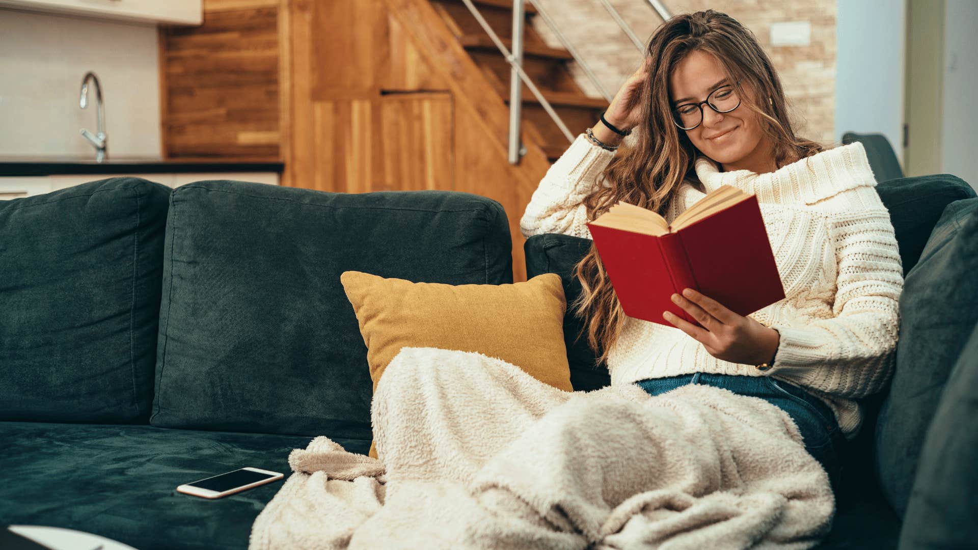 woman reading a book as a reward to help when things feel like too much effort