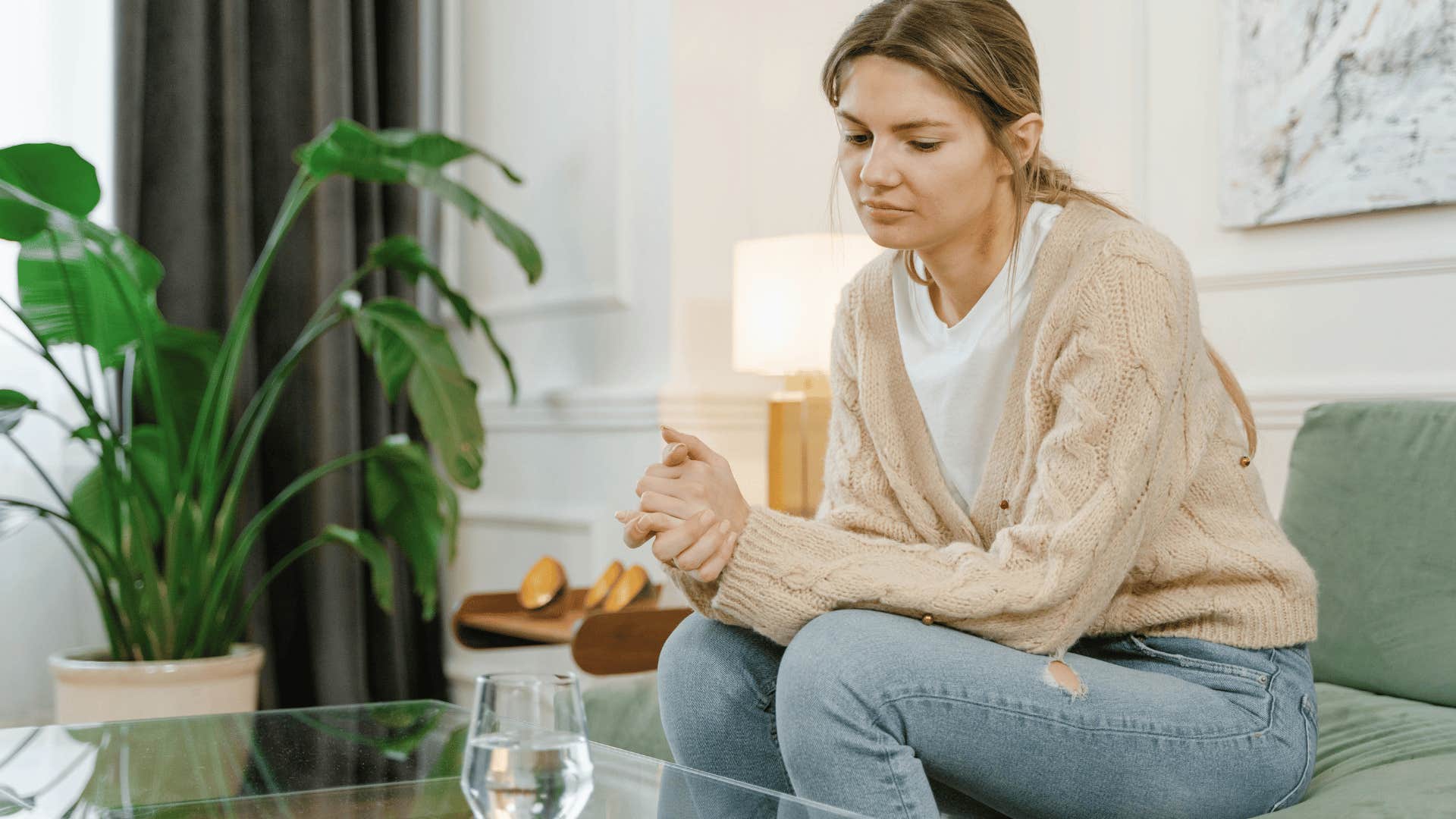 woman sitting alone thinking about relationship with step children