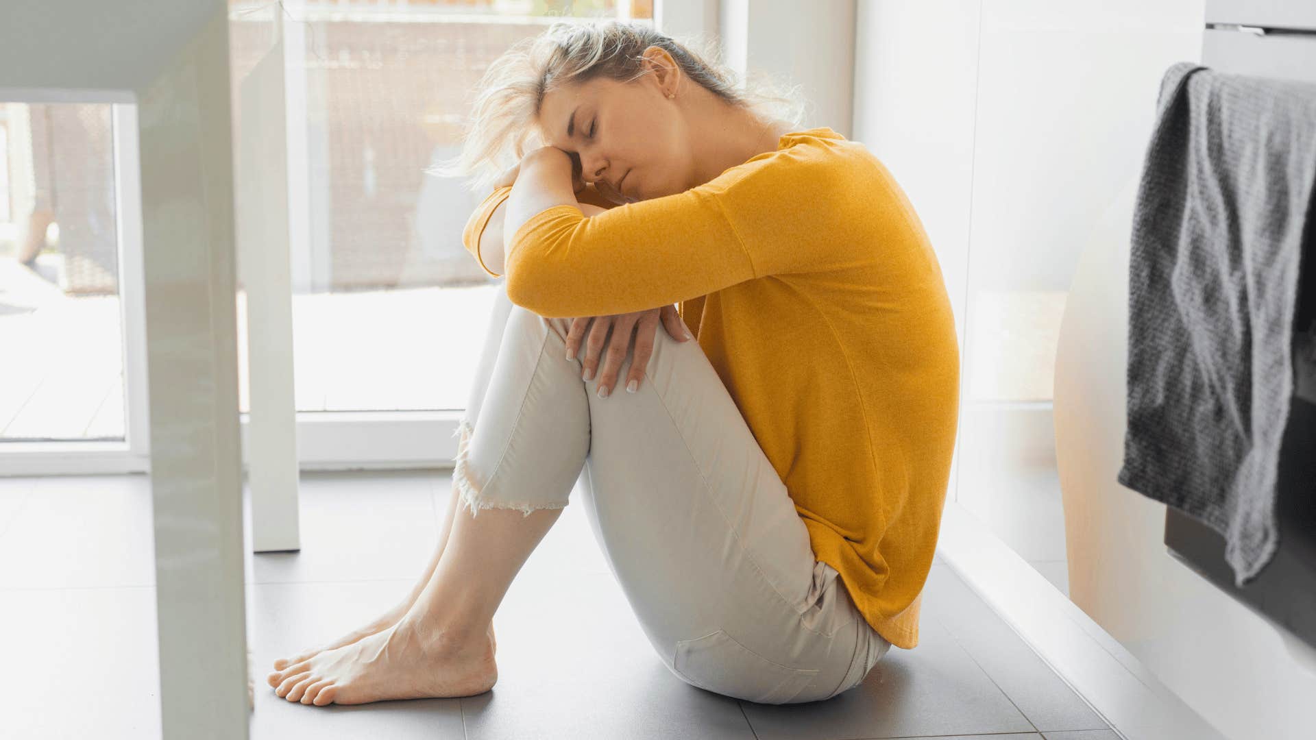 woman sitting alone on the floor feeling off might be more than sadness