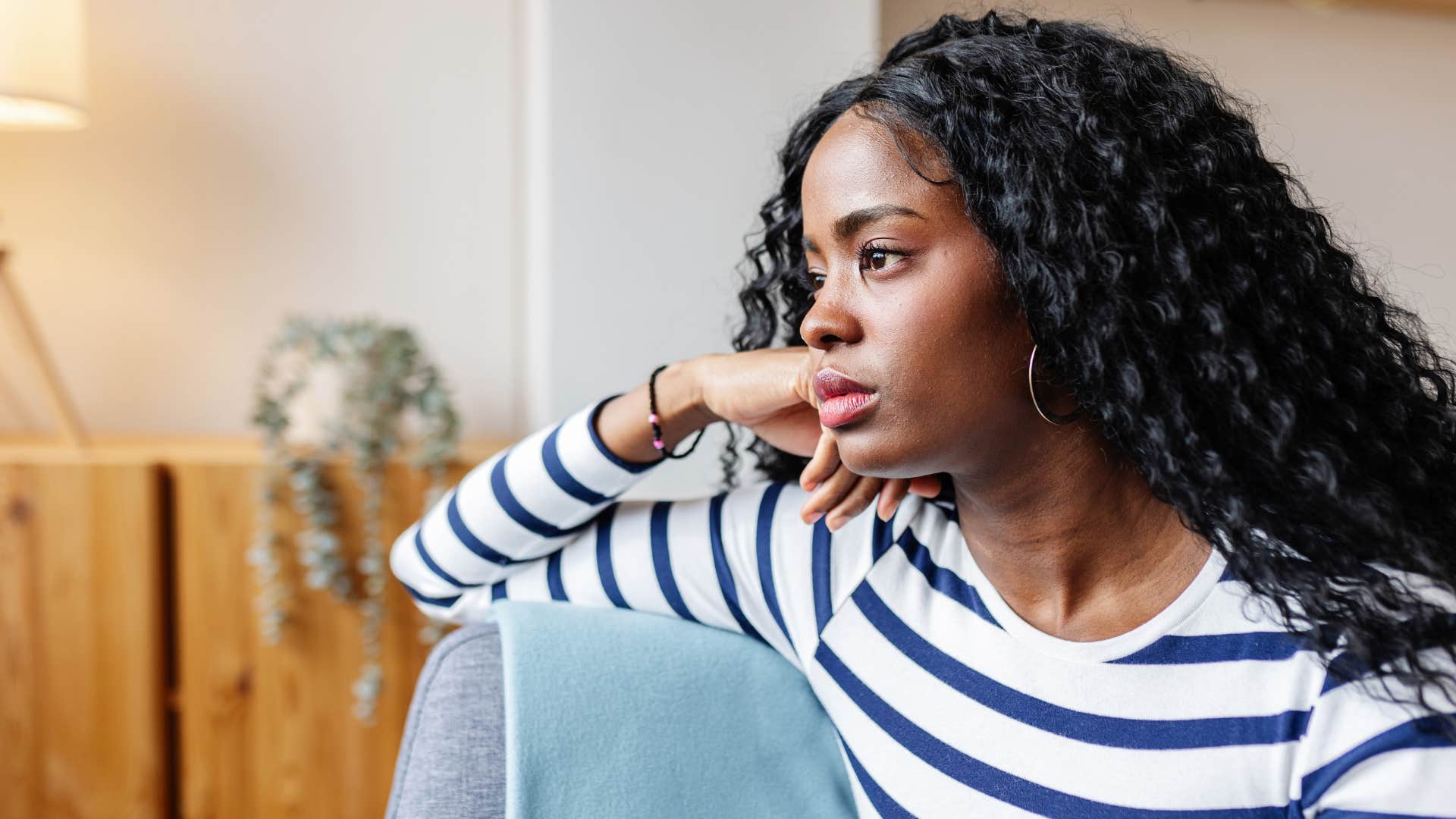 woman who never gets dressed up daydreaming at home
