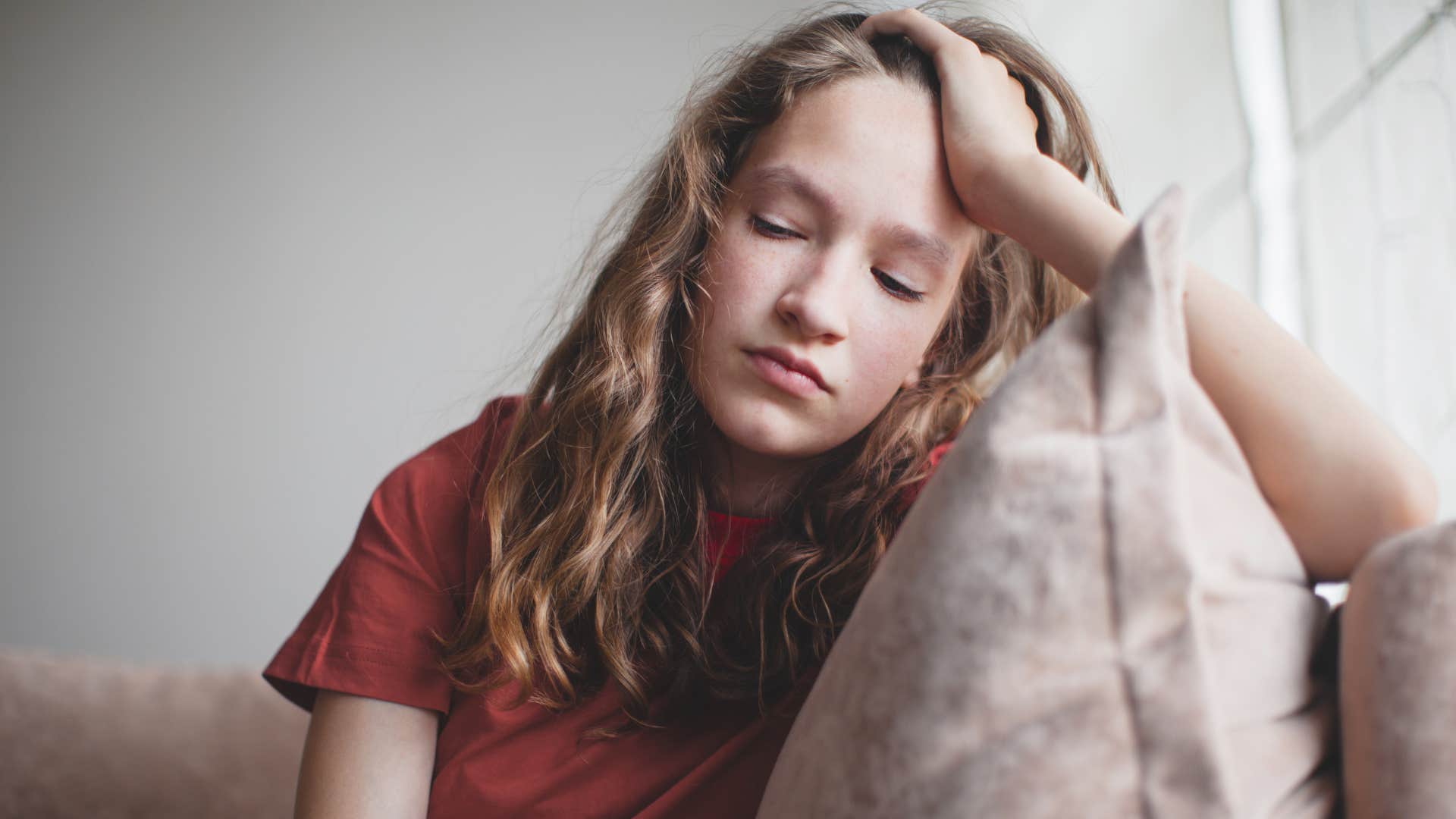 young woman who was forced to mature early looking tired