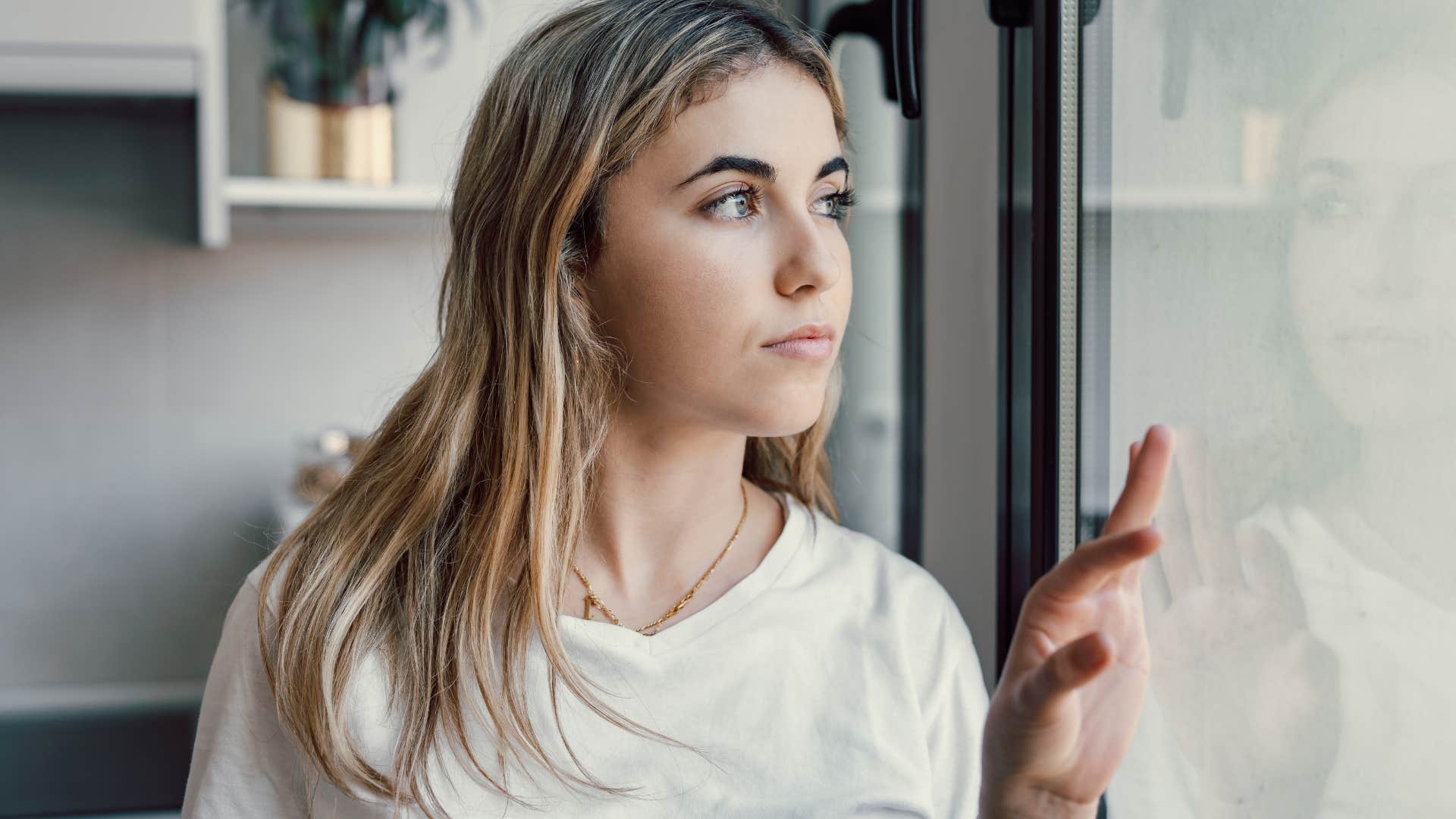 woman who has never had a safe space looking worried