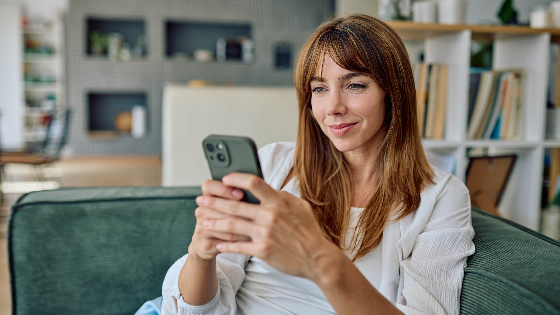 woman looking on her phone not chasing trends