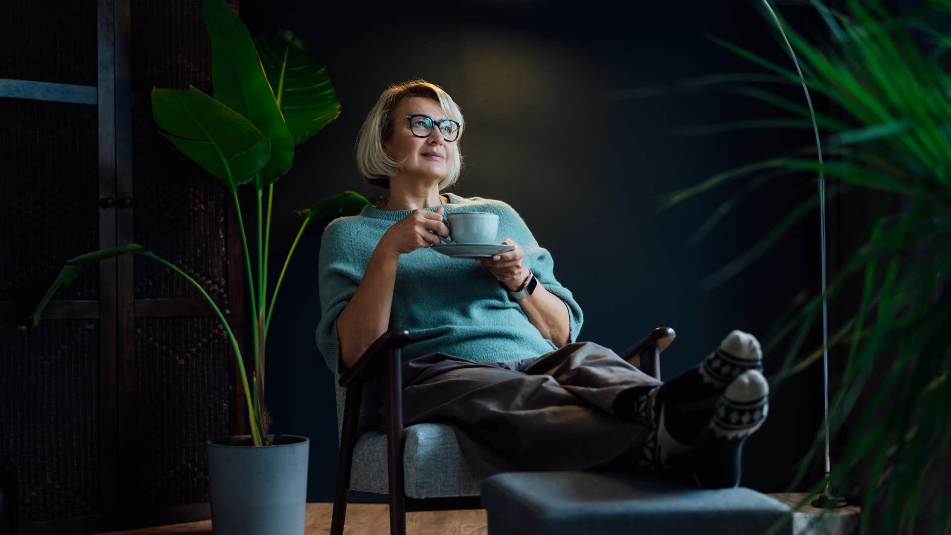woman relaxing at home not needing constant change to feel fulfilled