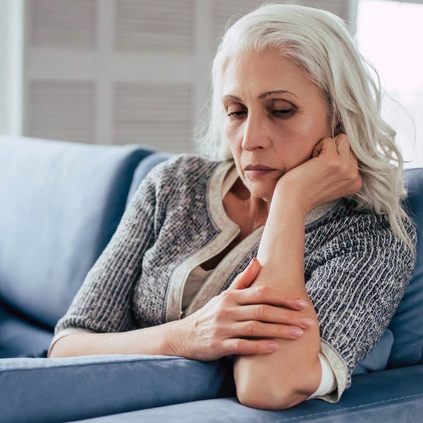 annoyed older woman whose needs aren't being met sitting alone