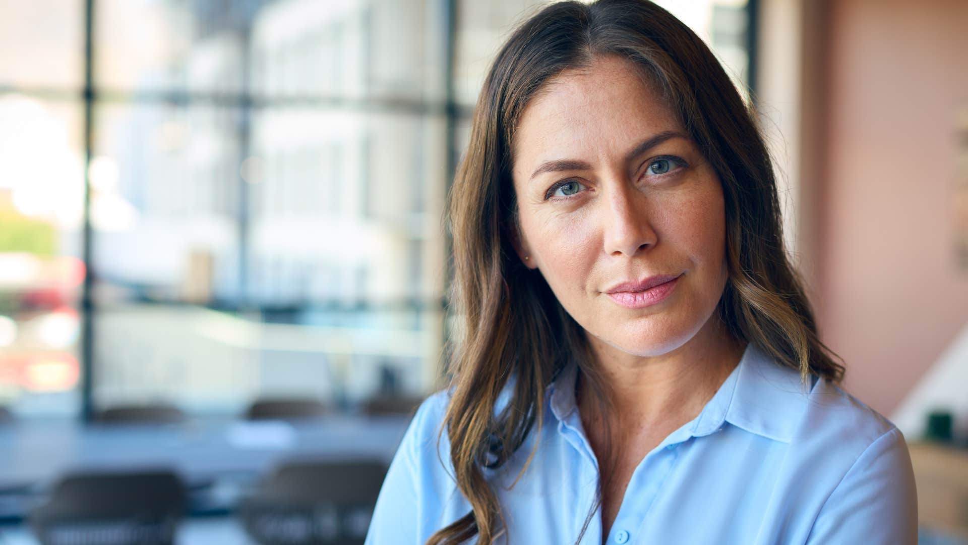 Woman who's become incredibly independent smiling at the camera.