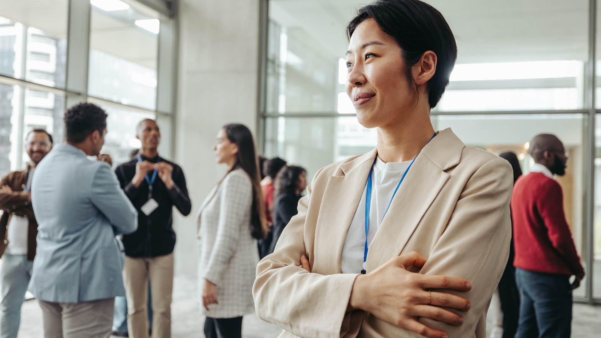 Woman who's observant in social situations smiling at work.