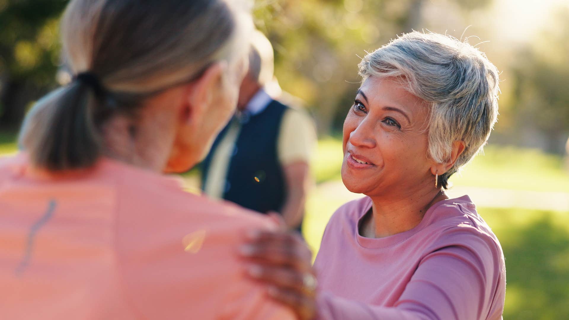 Woman who can sense other people's energy comforting a friend.