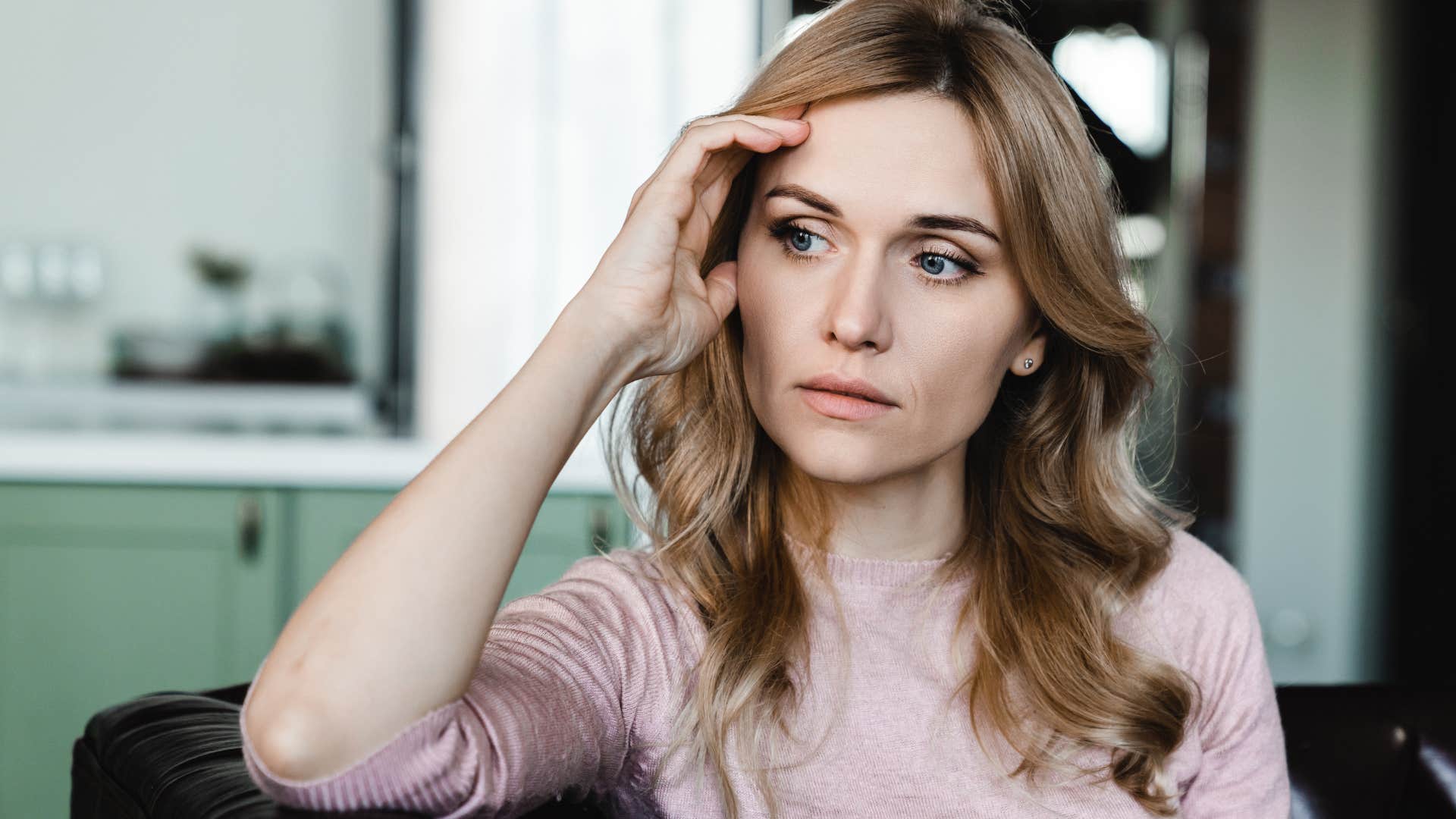 Woman battling chronic stress and burnout at home.