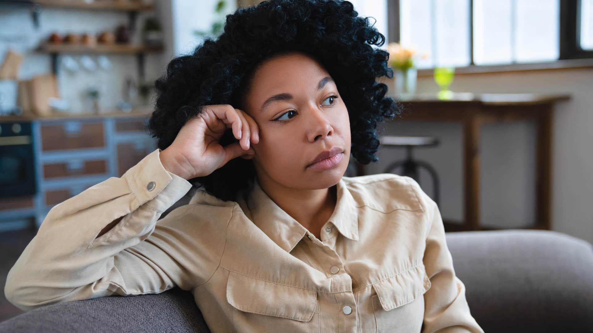 Woman struggling with embarrassment or shame at home.