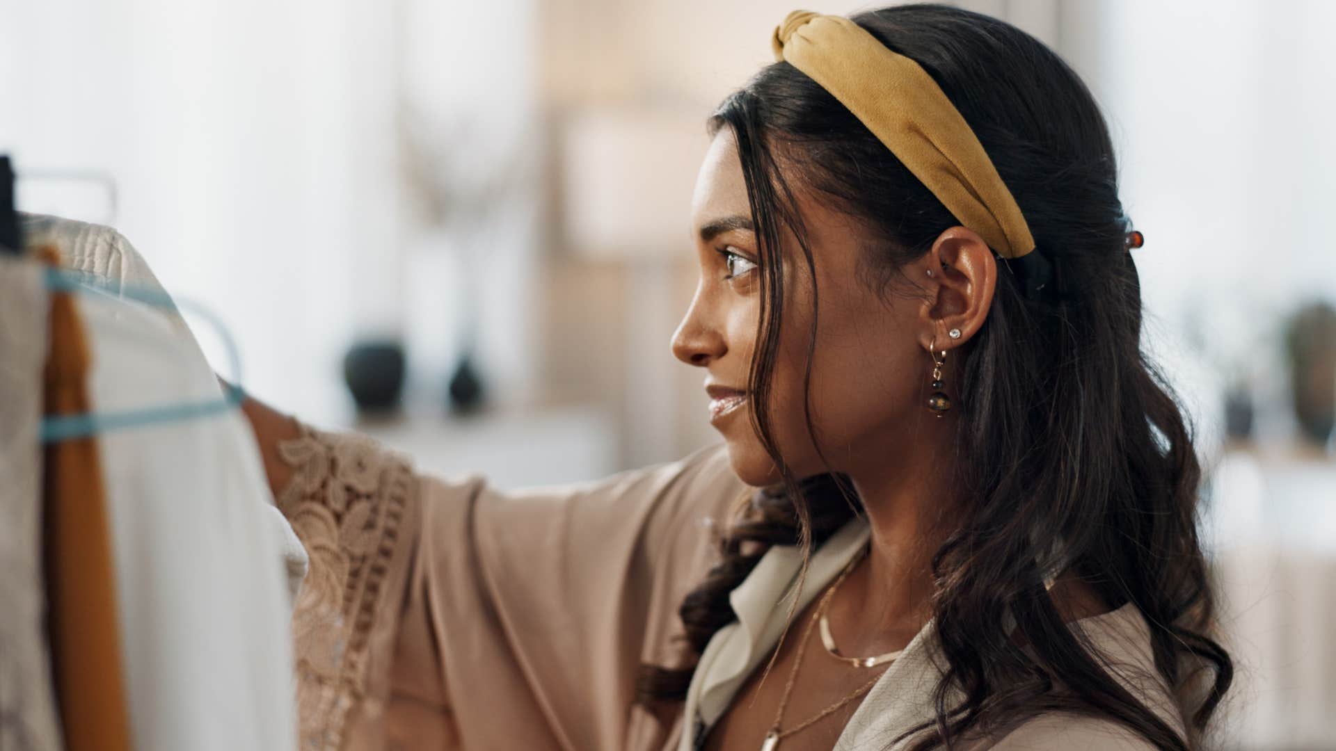 big-picture thinking woman clothing shopping for a sale