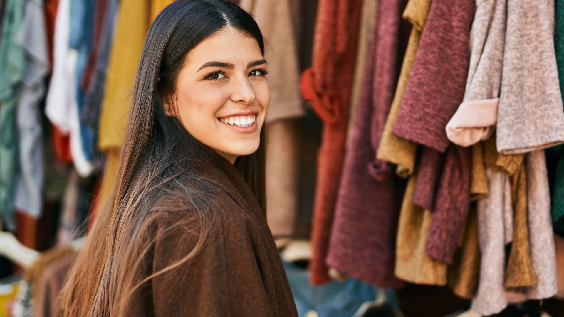 self-aware woman shopping sales racks at a store