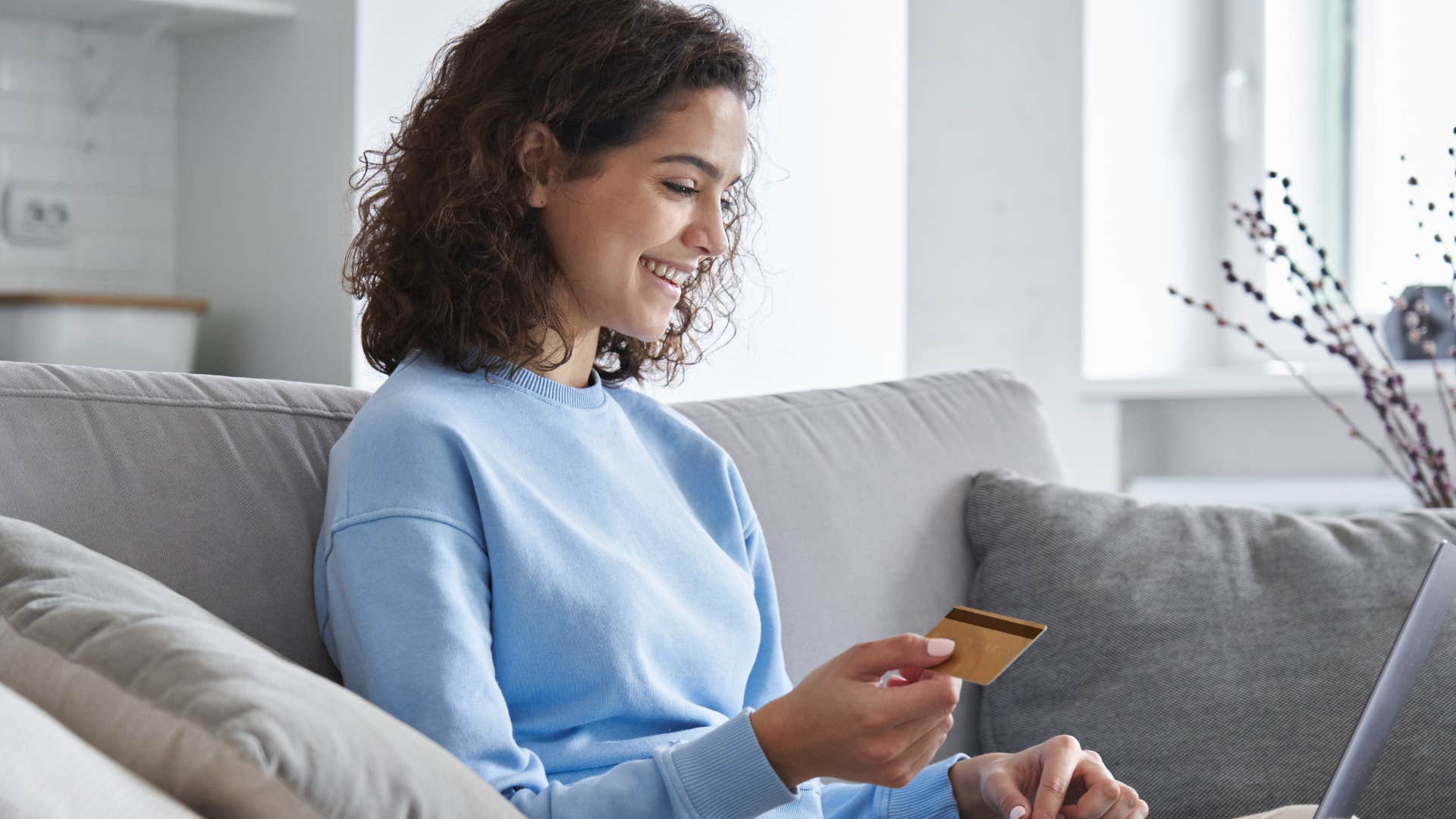 woman thinking logically about money shopping sales on her computer