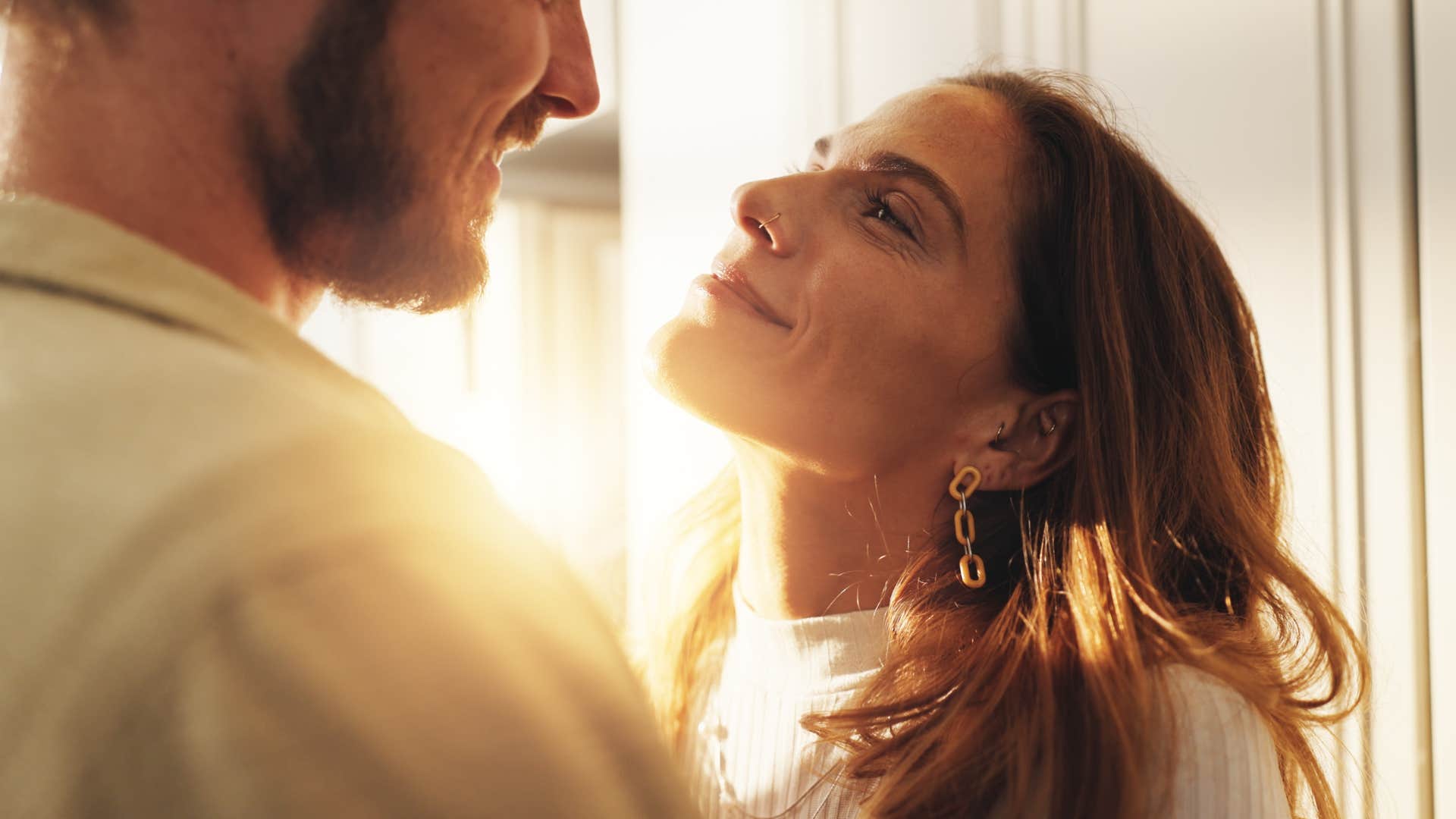 Woman who initiates affection with her partner.