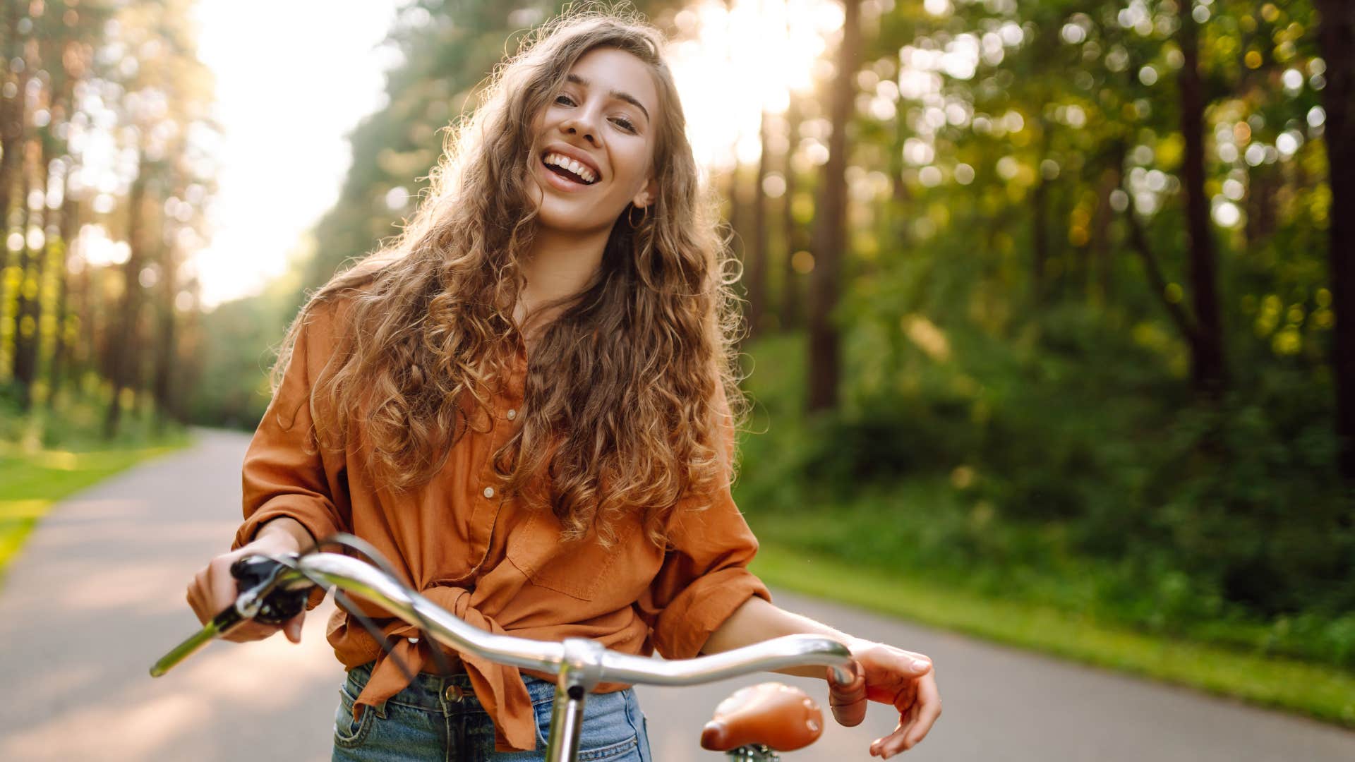 woman riding a bike connecting to nature
