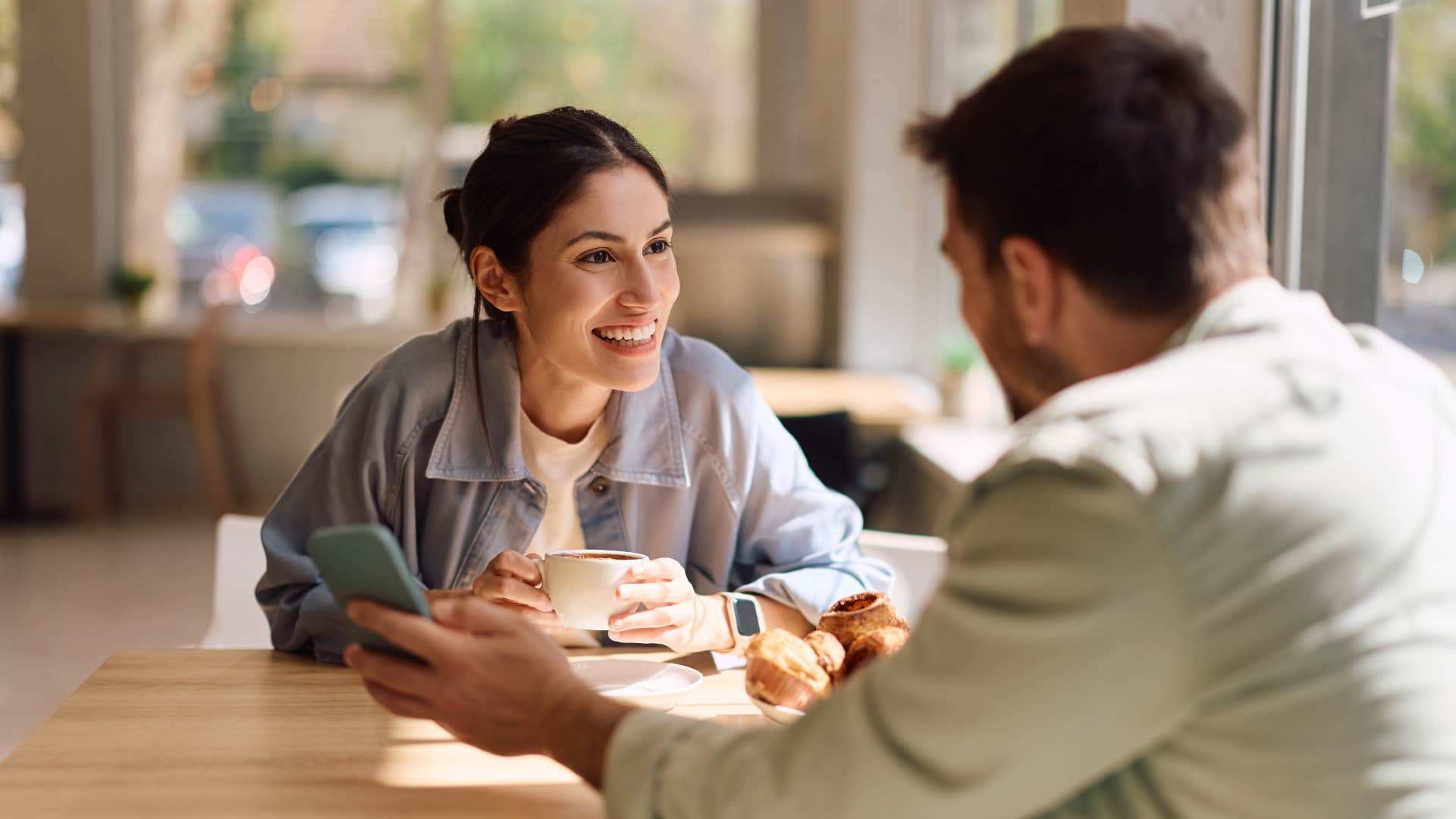 woman driving man away baby talking him at a restaurant