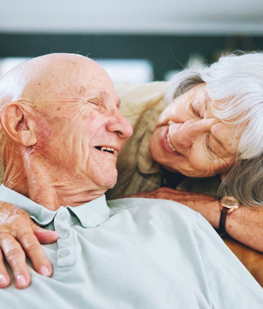 Loving elderly couple share closeness