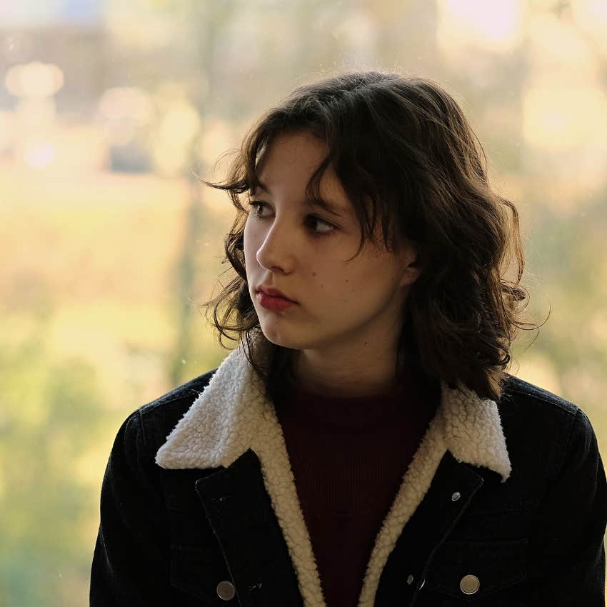 Woman that has become reflective listening to melancholy music