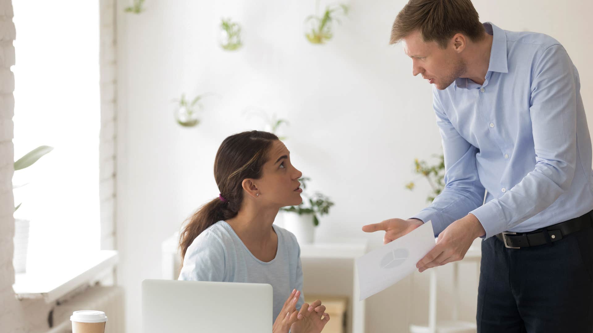 boss confronting employee who won't take responsibilty for errors