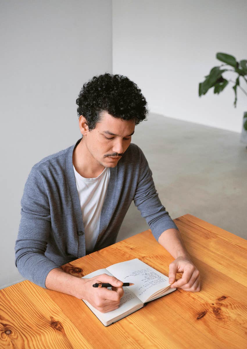 young man journaling about gratitude to stop worrying about everything