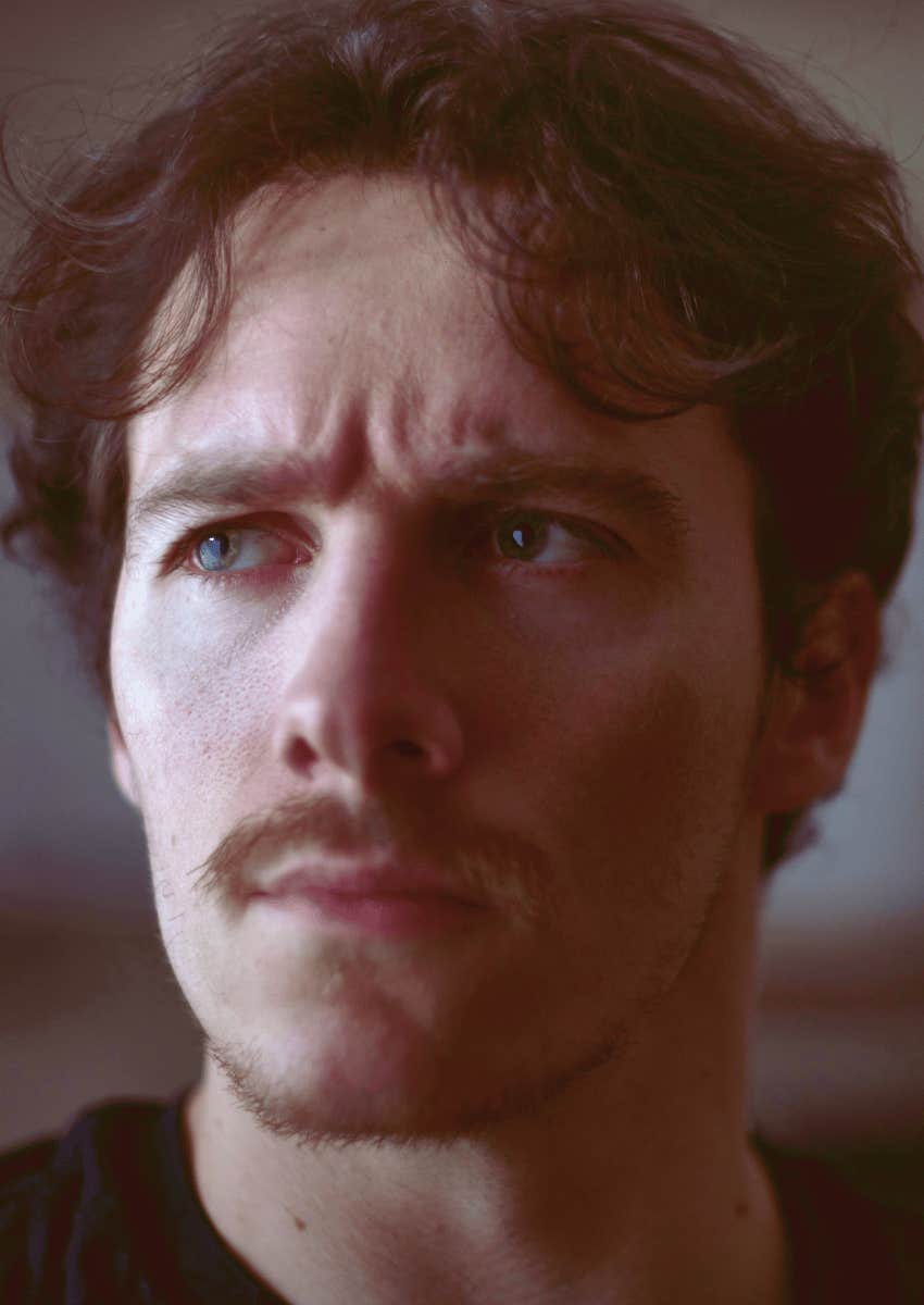 lonely young man with a serious expression