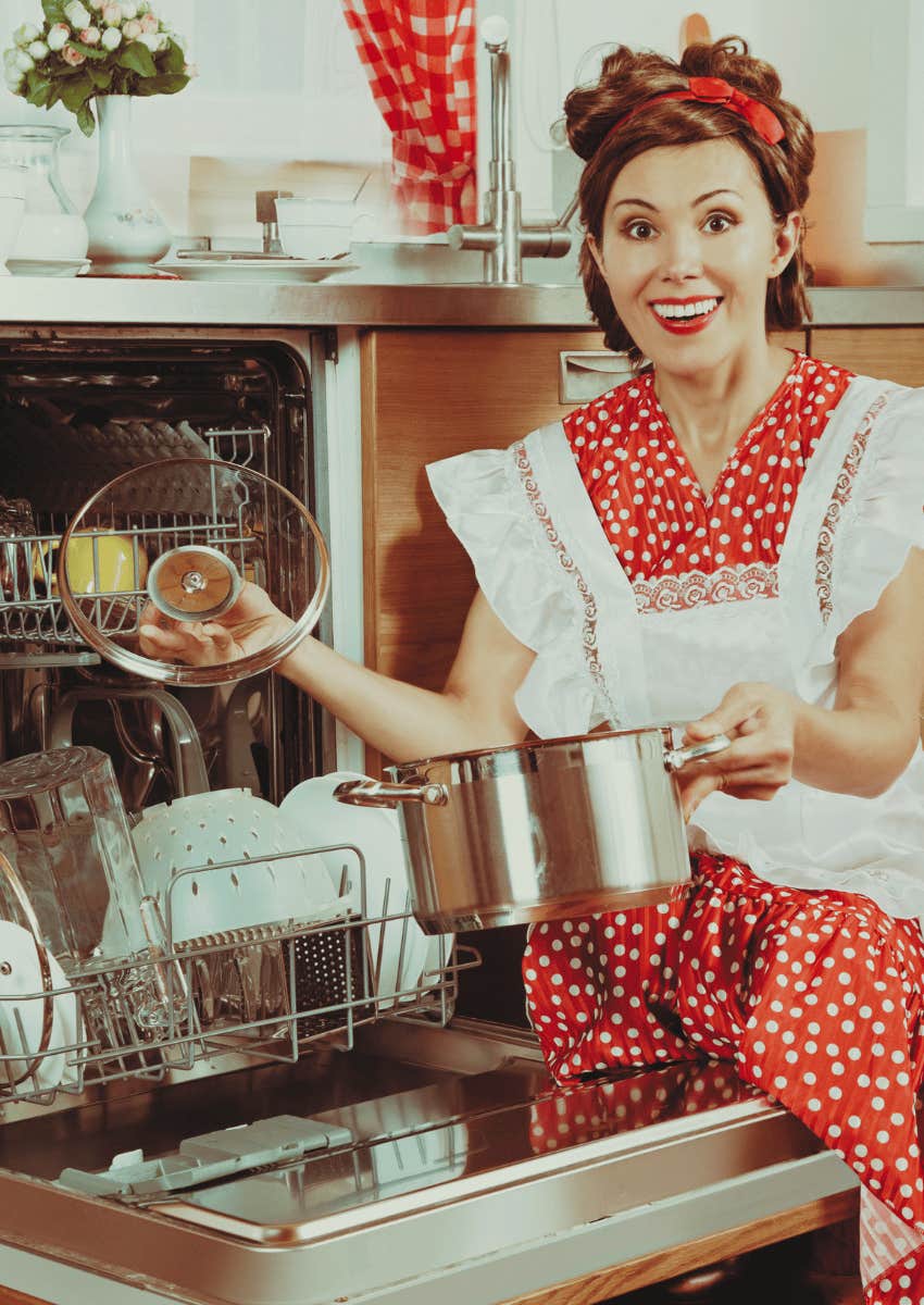 smiling 1950s housewife cleaning